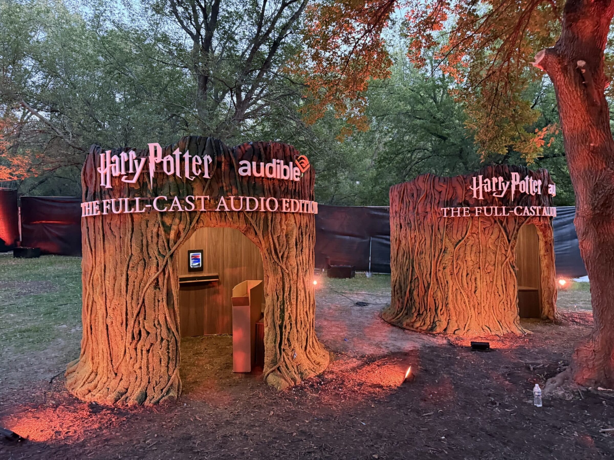 Harry Potter Audible tree trunk booths with "The Full-Cast Audio Edition" signage.