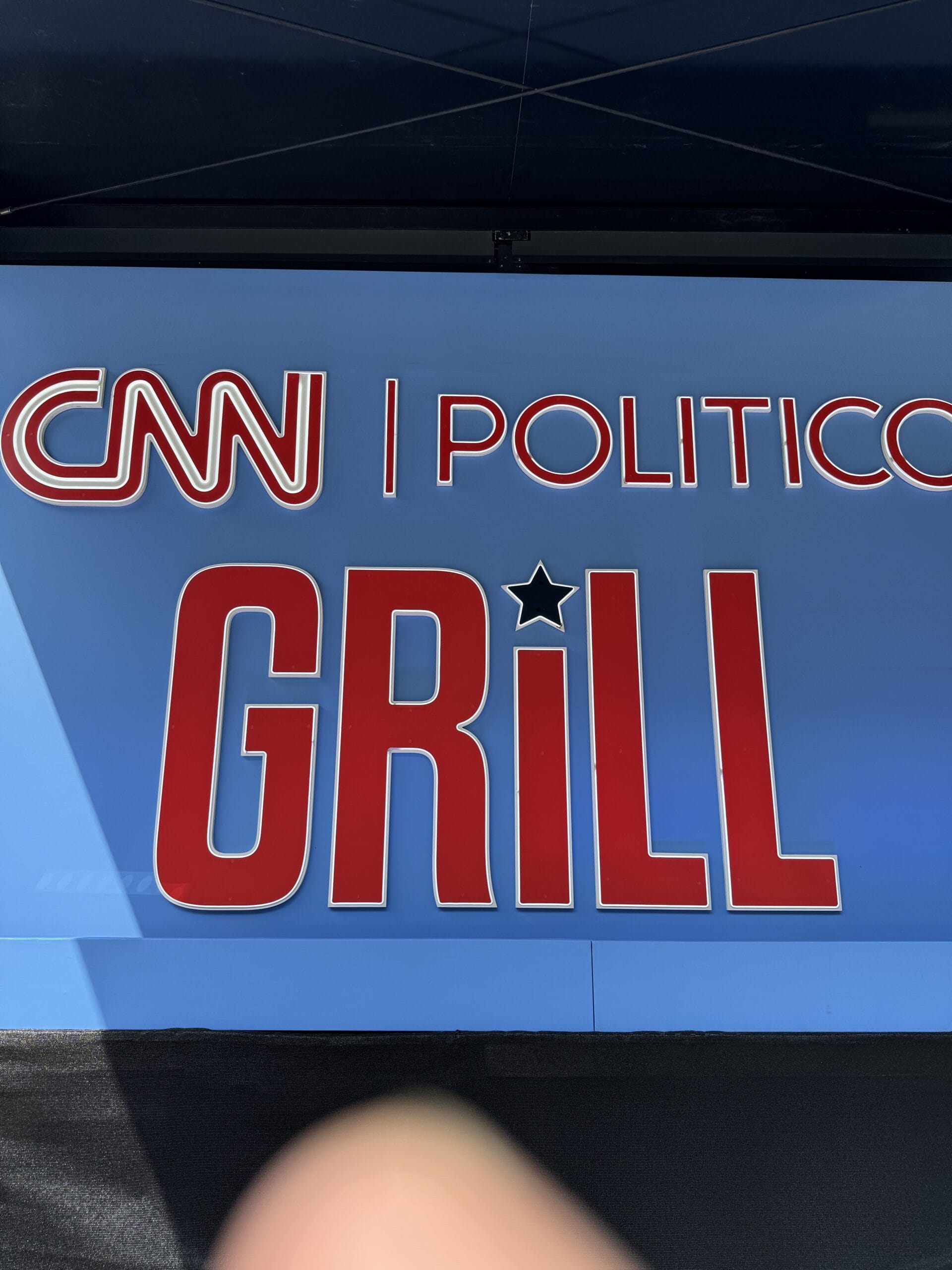 CNN | POLITICO GRILL sign with a black star.