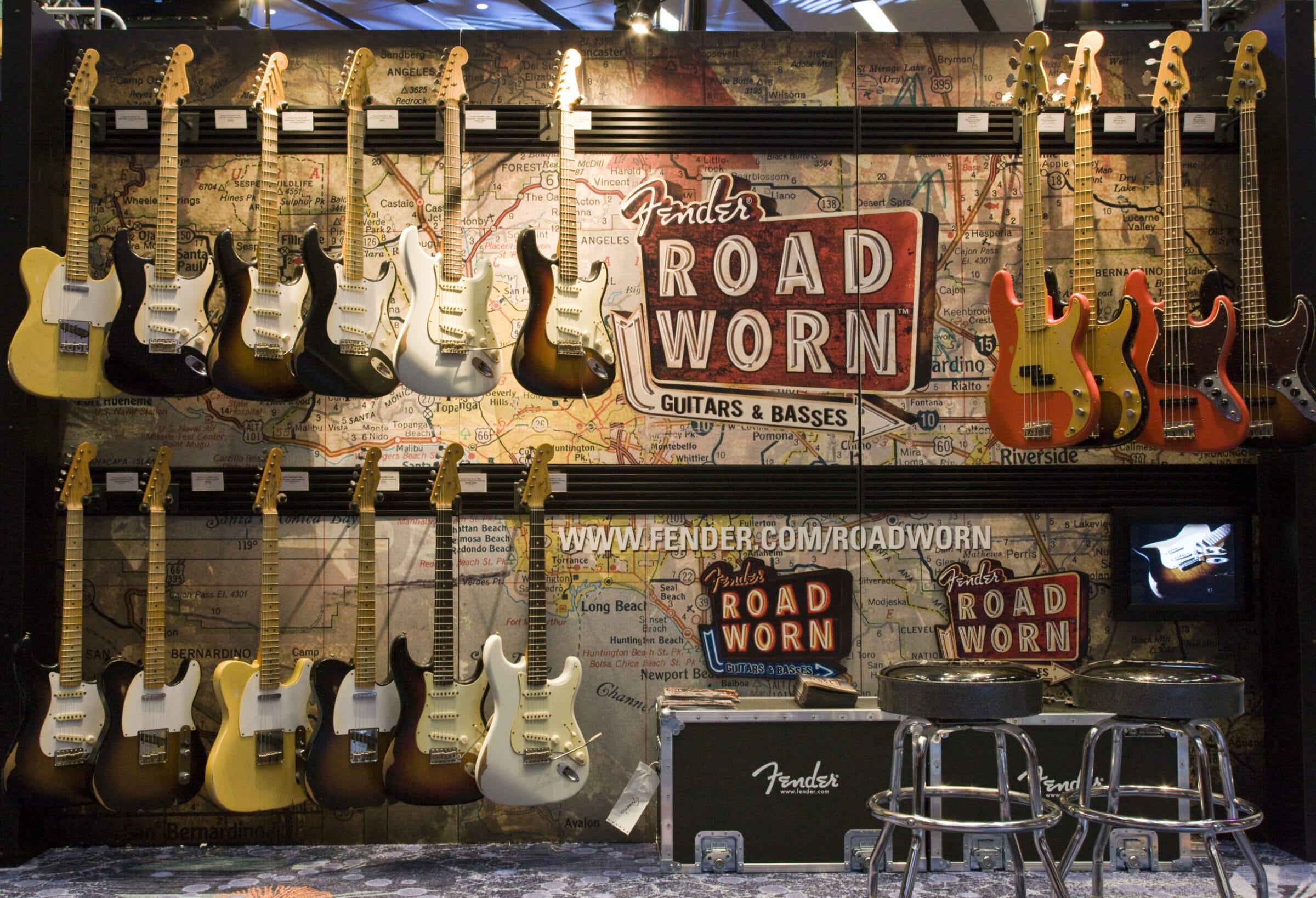 Fender Road Worn guitars and basses displayed on a map background.