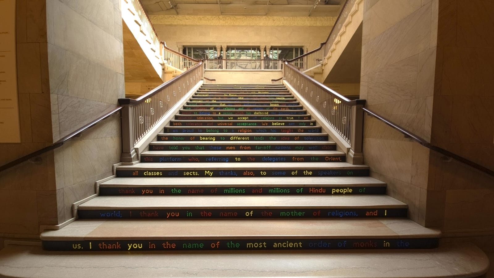 Staircase with colorful text on each step, reading "I thank you in the name of..."